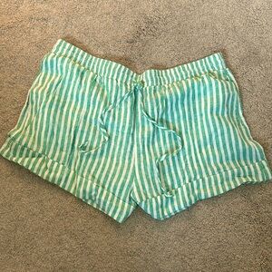 Green and white striped linen shorts.